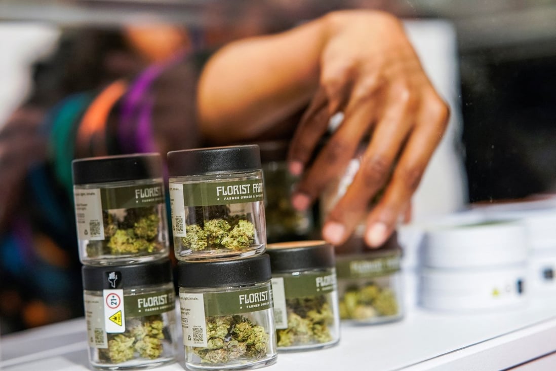 A worker organises cannabis flowers on Thursday before the opening of New York’s first legal recreational marijuana dispensary, in Manhattan. Photo: Reuters