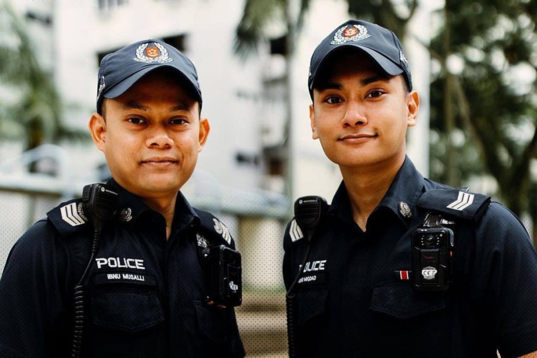Singapore police officers Ibnu Musalli (left) and Miqdad Fisall rescued a woman who was trapped in her toilet for four days. Photo: Instagram/Singapore Police Force