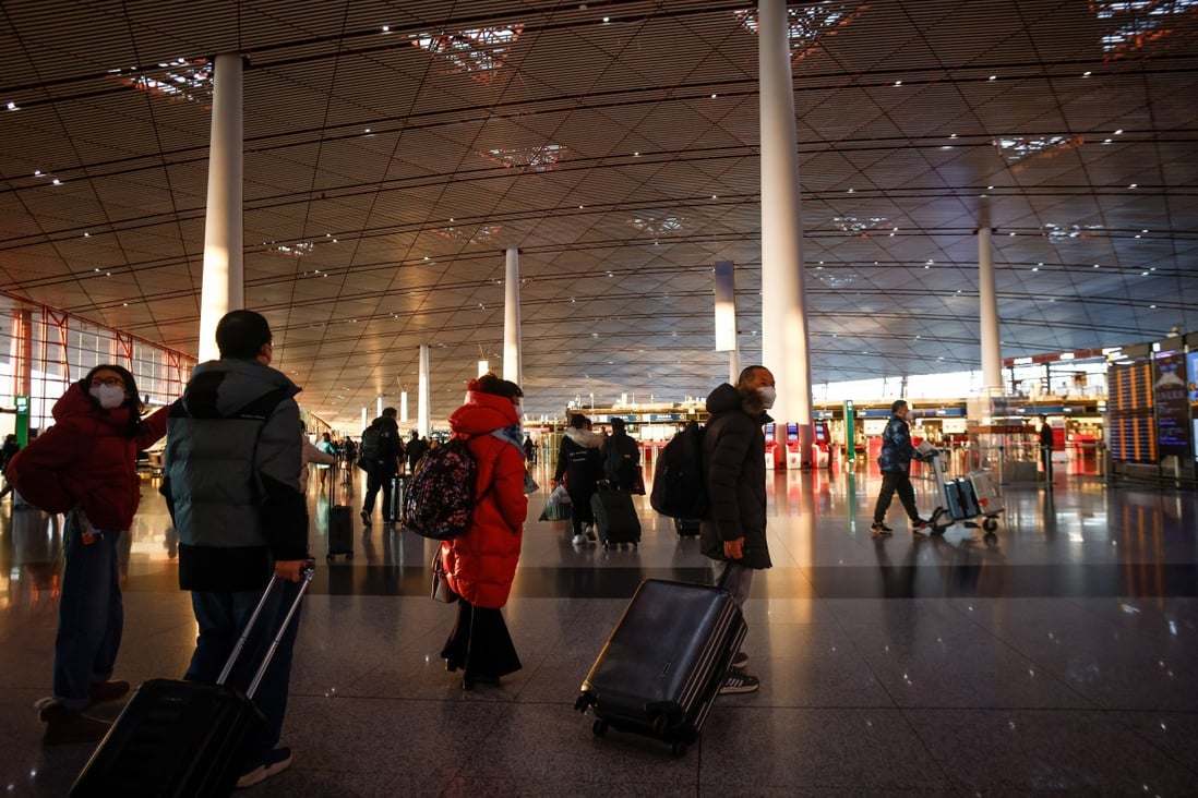 Travellers at the Beijing Capital International Airport. China will lift all border controls on January 8. Photo: EPA-EFE 