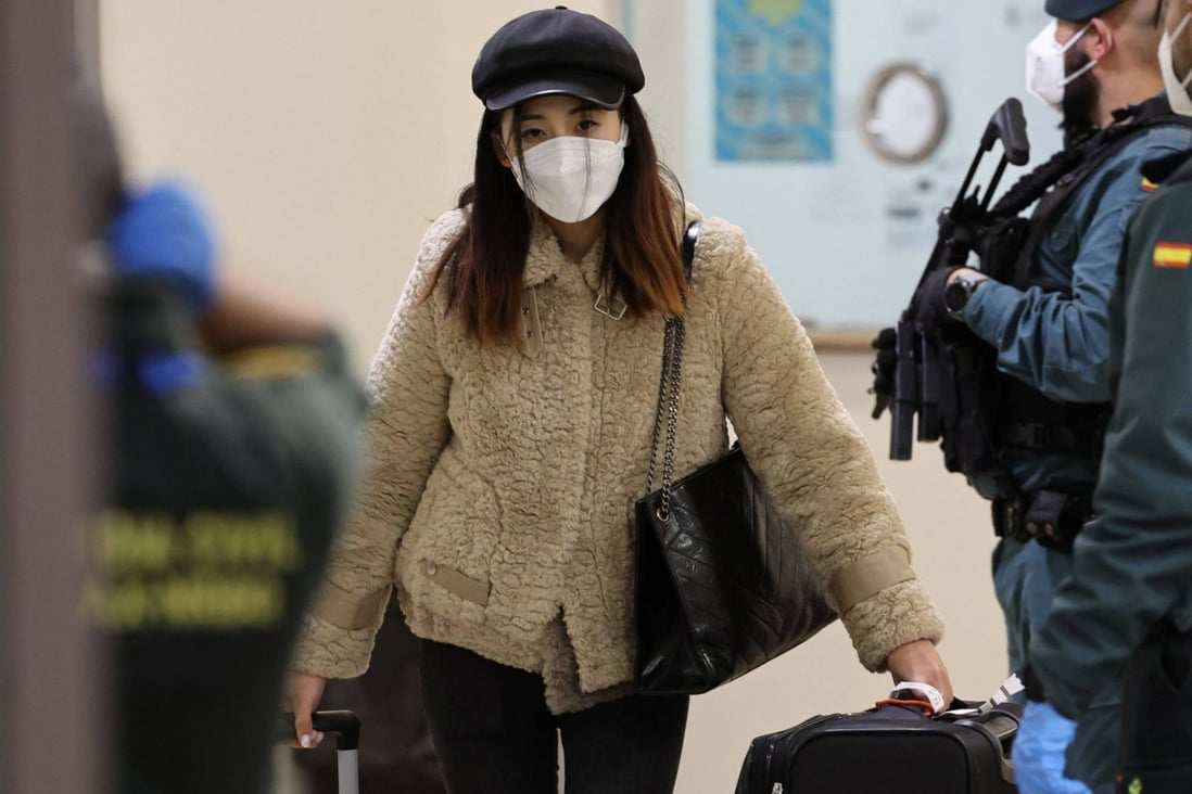 A passenger of a flight from Beijing leaves the terminal after landing at the Adolfo Suarez Madrid-Barajas airport on the outskirts of Madrid, on December 31, 2022. Photo: AFP/File