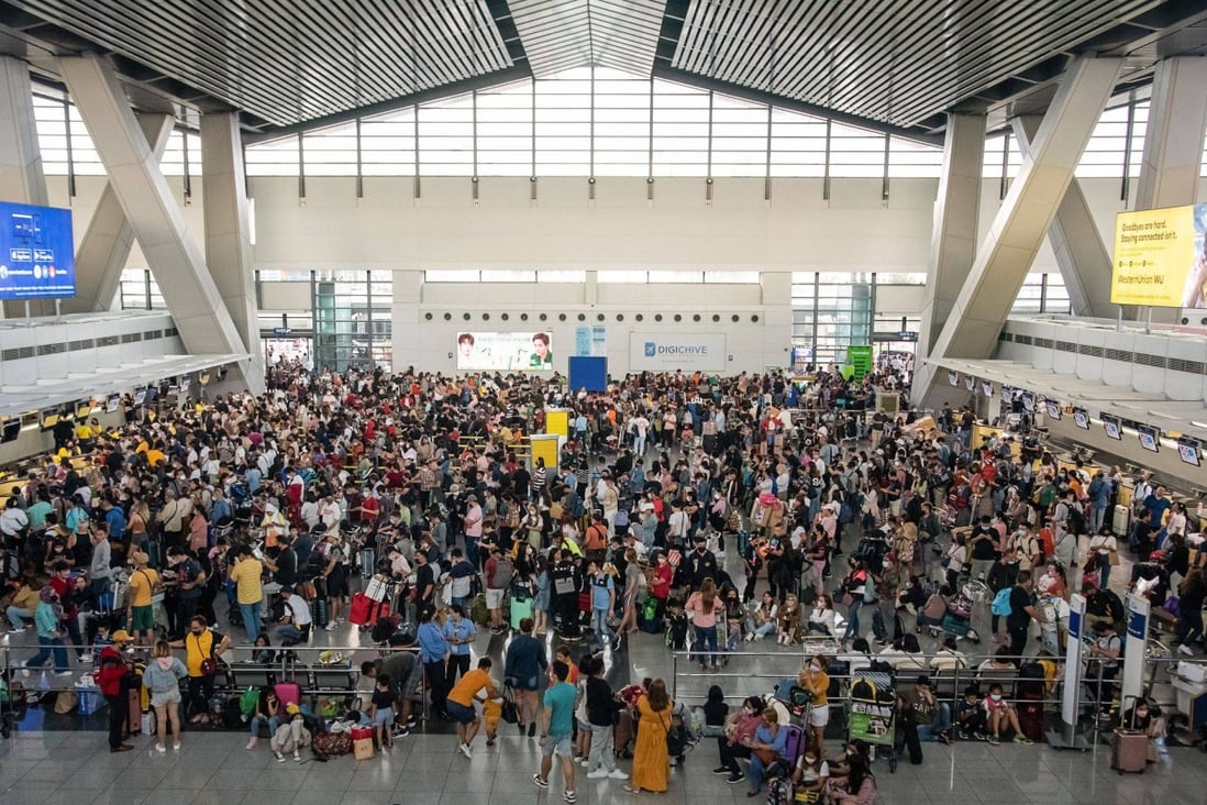 Stranded passengers wait for information about their flights at terminal 3 of Ninoy International Airport in Pasay, Metro Manila on Sunday. Photo: AFP