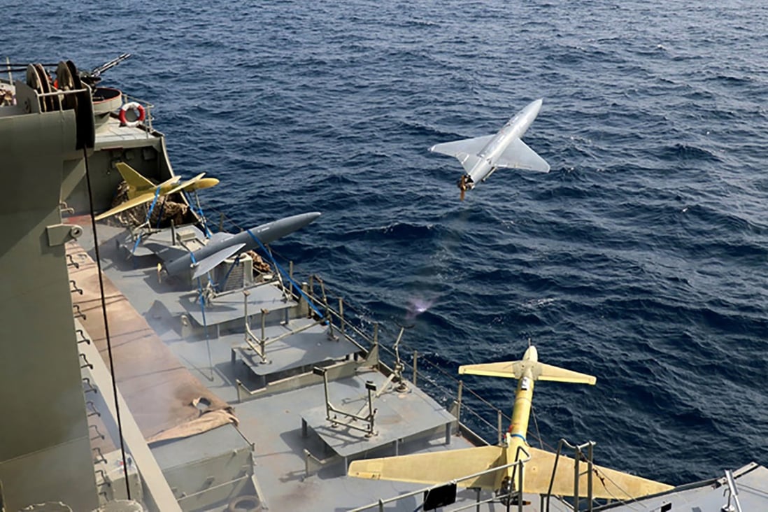A drone is launched from a warship during a military drill in Iran in August. As protests rage at home, Iran’s government is increasingly flexing its military muscle abroad. Photo: Iranian Army via AP