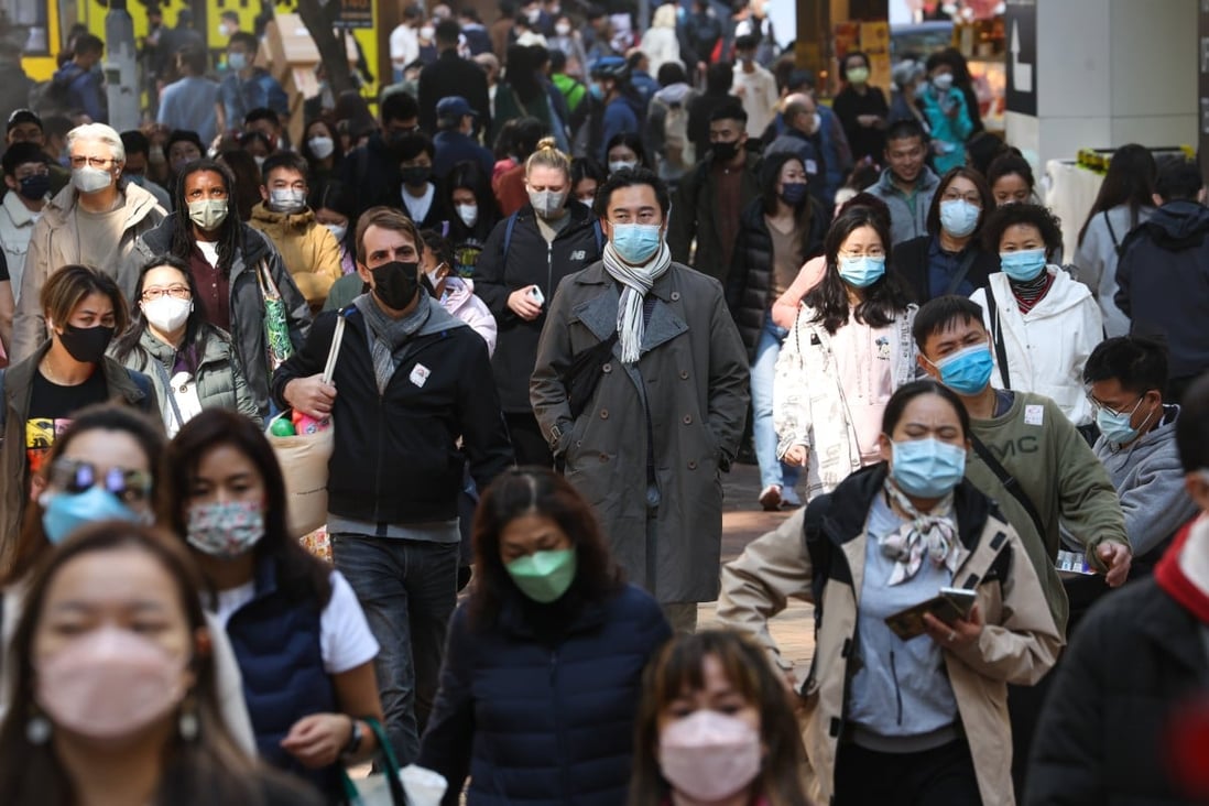 Commuters in Hong Kong’s Causeway Bay. The city has been reporting daily Covid caseloads of more than 20,000. Photo: Edmond So