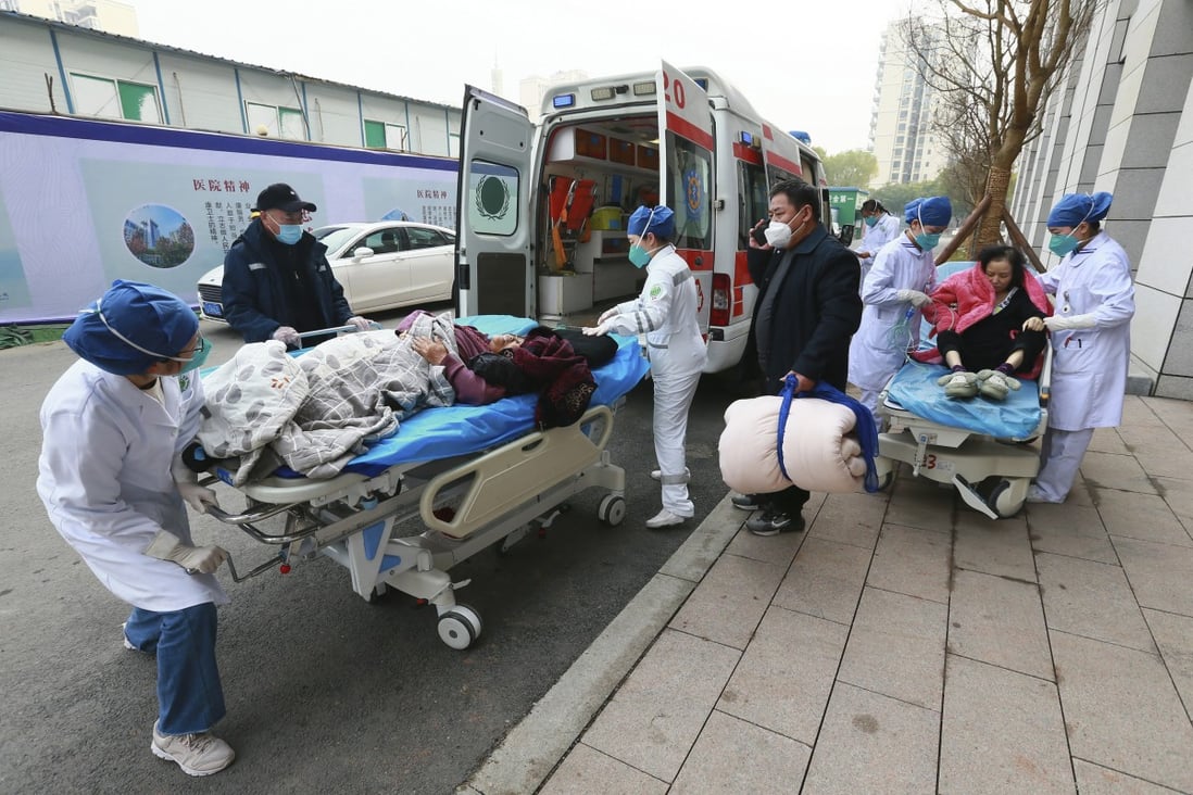 Medical workers receive patients arriving in ambulances at a hospital in Suining, in southwestern China’s Sichuan province. Photo: AP 