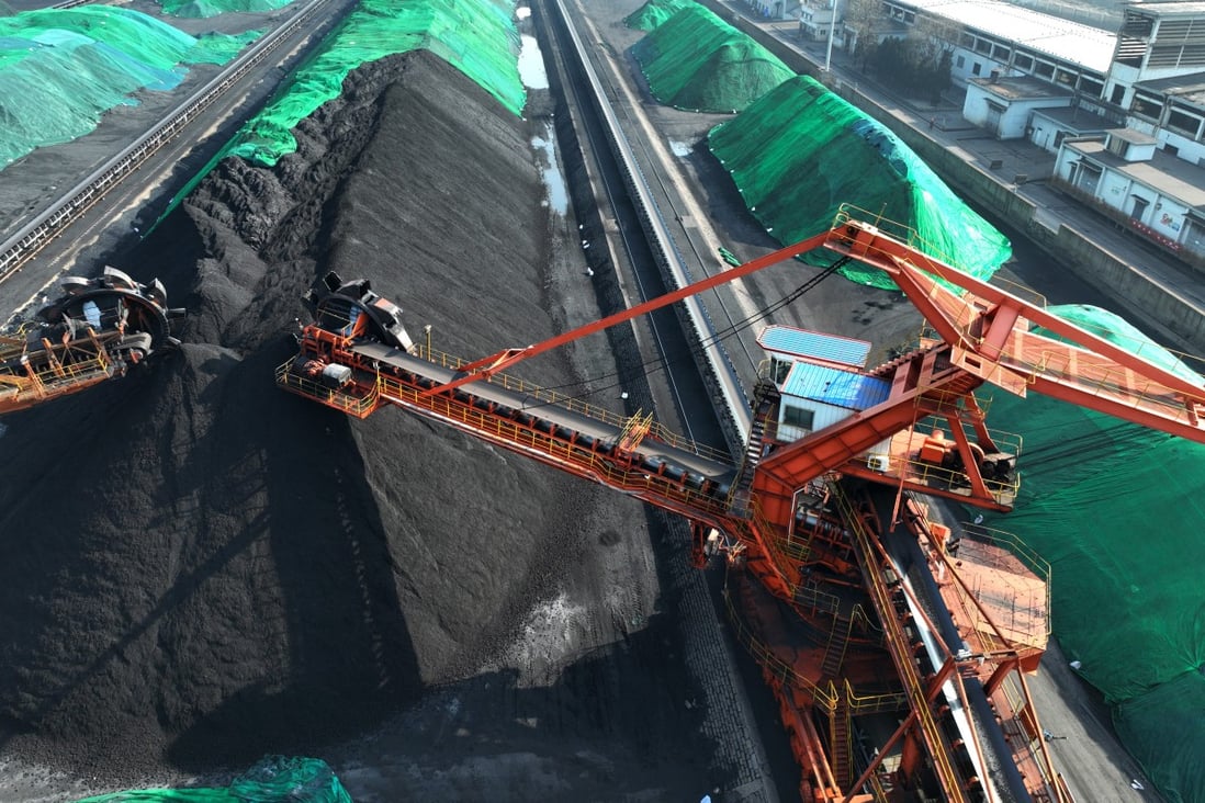 Conveyor belts of coal at Lianyungang port in Jiangsu on December 21. China’s abrupt policy change on coal power projects will pose an obstacle to its net-zero goal. Photo: Getty Images