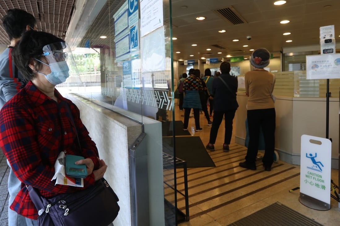 Residents queue up at the Standard Chartered Bank in Chai Wan in March. Photo: Yik Yeung-man