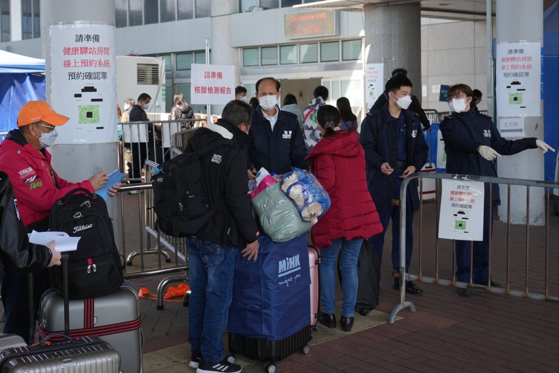 Travellers from Hong Kong queue to cross the border into mainland China at the Shenzhen Bay checkpoint.  Photo: Sam Tsang
