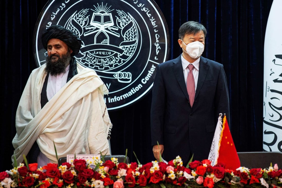 Afghanistan’s acting first deputy prime minister Abdul Ghani Baradar (left) and China’s ambassador to Afghanistan Wang Yu attend a press conference to announce an oil extraction contract with a Chinese company in Kabul on January 5, 2023. Photo: AFP