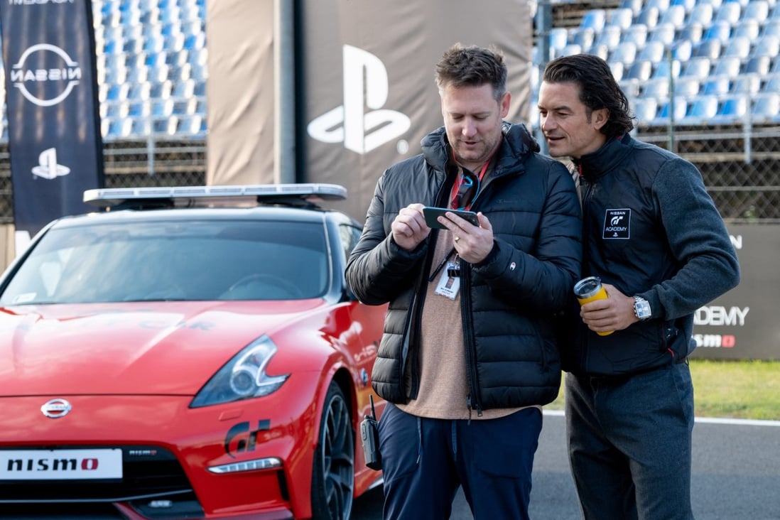 Orlando Bloom (right) and director Neill Blomkamp on the set of “Gran Turismo”. Sony is teasing the film at the CES 2023 technology trade show this week. Photo: Gordon Timpen/via Reuters