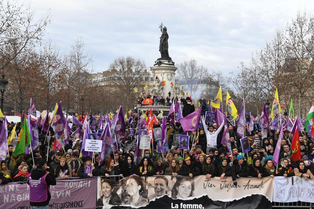 Demonstrators gather on Place de la Republique during a tribute march in memory of three Kurdish activists who were murdered in Paris in January 2013. Photo: AFP