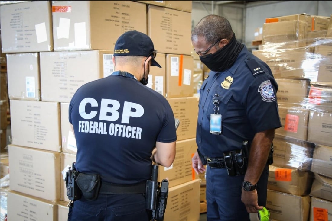 US Customs and Border Protection officers in Atlanta inspecting apparel suspected to have been made with cotton harvested by forced labour in China’s Xinjiang region. Photo: US Customs and Border Protection