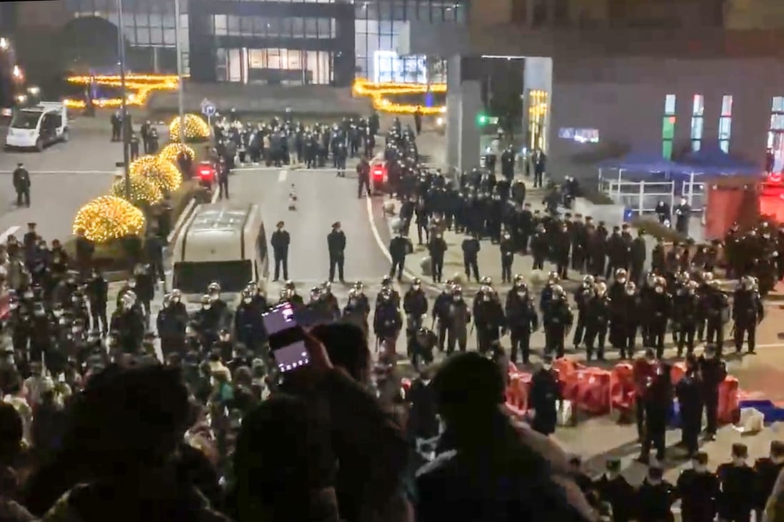 Riot police and workers appear to have clashed at a Covid test kit plant in Chongqing on Saturday. Photo: Twitter