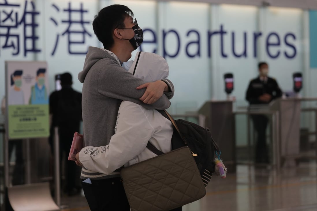 A couple embraces before parting at Hong Kong International Airport on April 3 last year. Photo: Xiaomei Chen