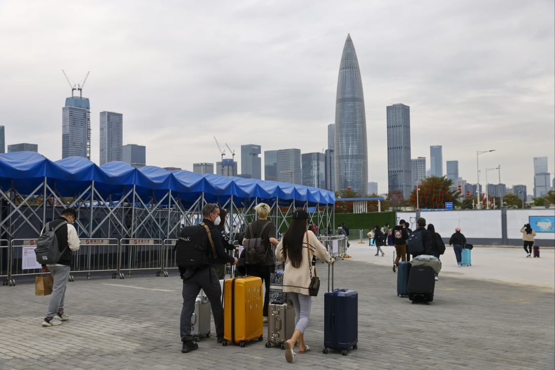Travellers at the mainland Chinese border in Shenzhen. China reopened its borders for international travel on Sunday and will roll out more pro-growth measures to steady the economy. Photo: Dickson Lee