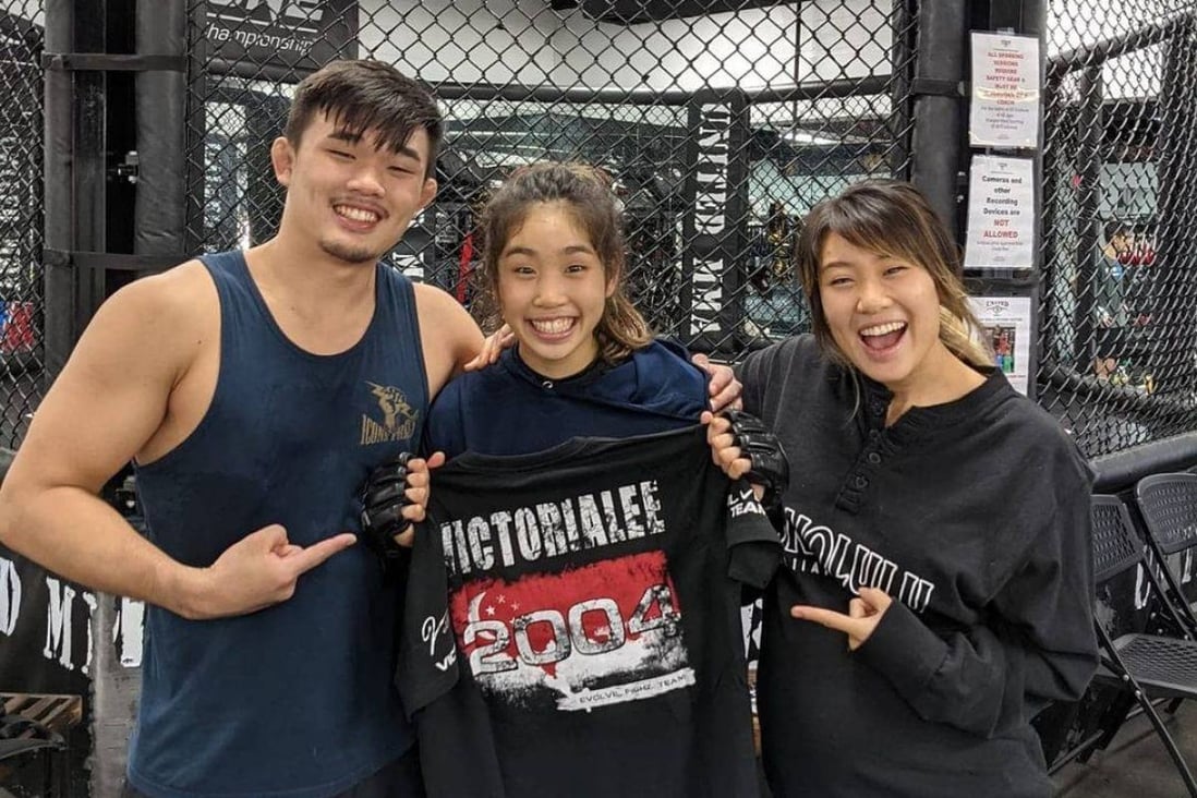 Christan Lee (left) and Angela Lee (right) with younger sister Victoria Lee at their family’s United MMA Hawaii gym. Photo: Instagram