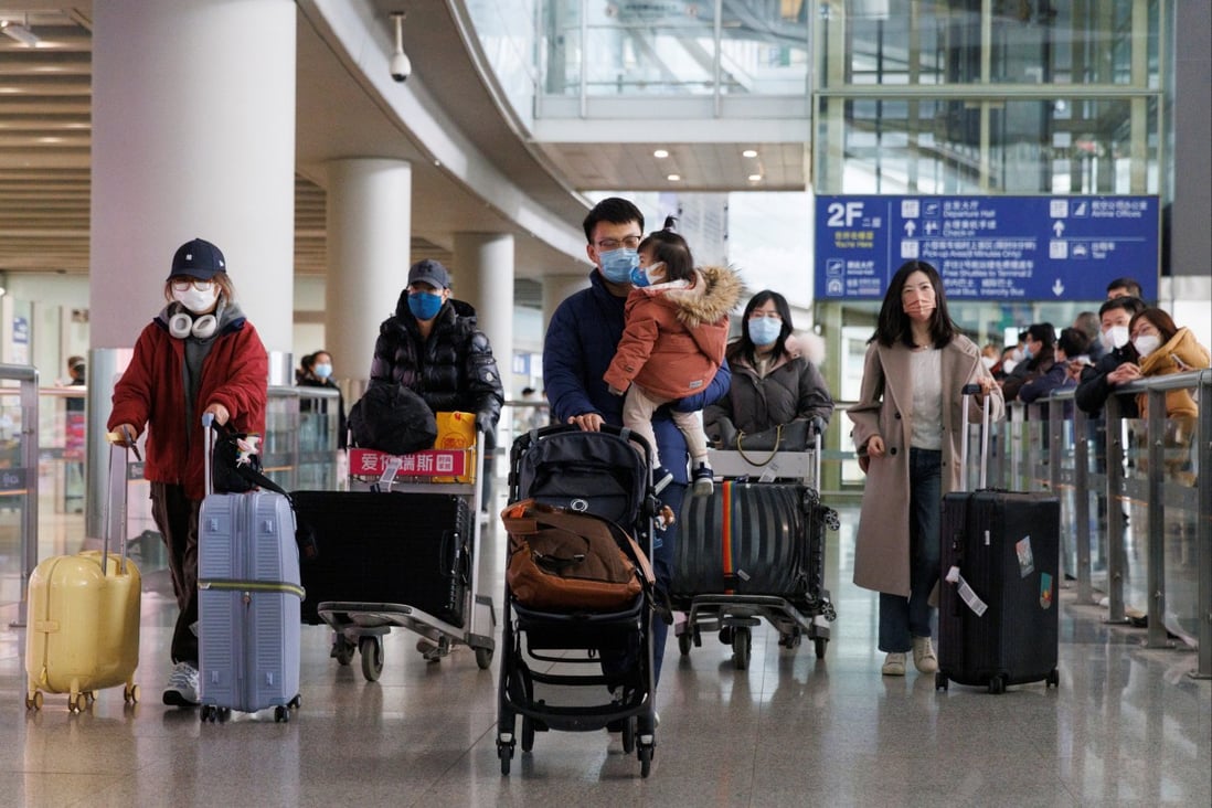 Travellers walk through the international arrivals hall at Beijing Capital International Airport on Sunday as overseas flights resumed in China. Photo: Reuters