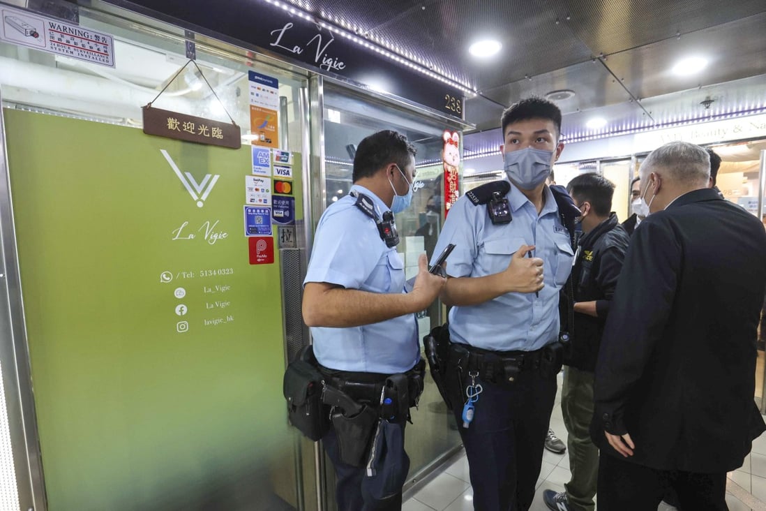Police officers investigate a robbery at a watch shop on the second floor of W Plaza shopping centre on Nathan Road in Yau Ma Tei. Picture: Edmond So