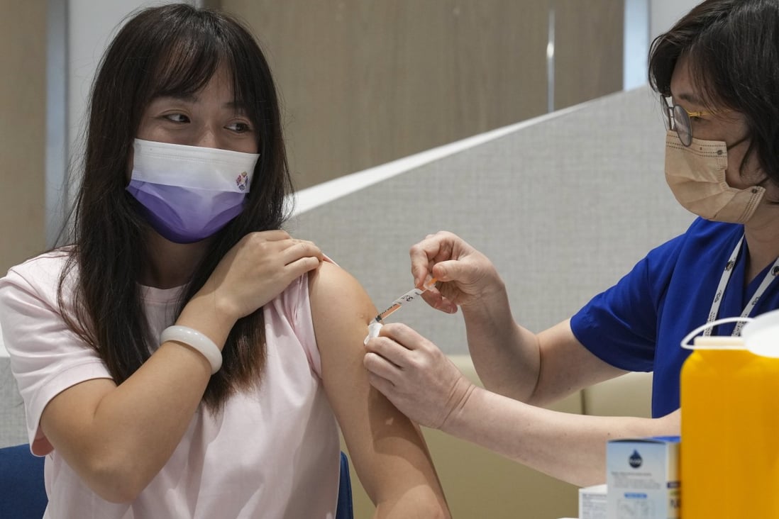 A patient receives a dose of the bivalent vaccine at a private clinic in Tsim Sha Tsui. Photo: Sam Tsang