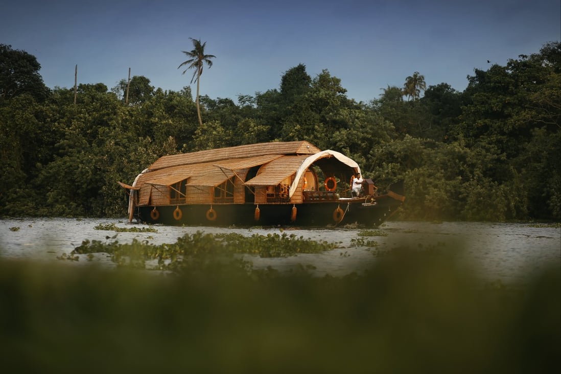 A converted barge plies the waters of Kerala, India. Luxury river cruises are taking off in the country and offer a different way to appreciate its scenery, history and culture at a gentle pace. Photo: CGH Earth
