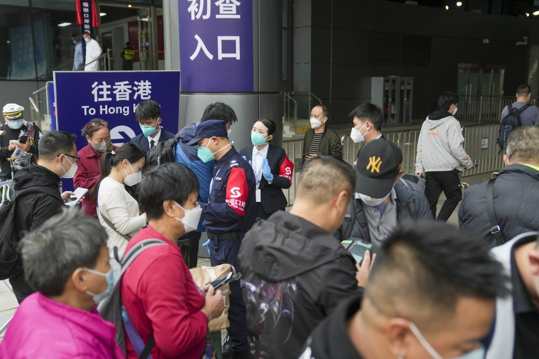The first passengers cross the Lok Ma Chau Spur Line checkpoint between Hong Kong and mainland China after travel resumed. Photo: Sam Tsang