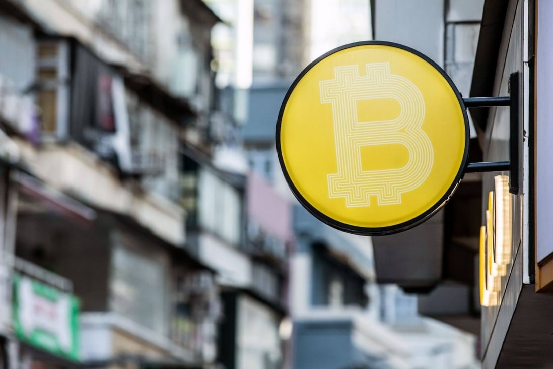 A Bitcoin logo in Hong Kong. Crypto assets could be useful to society if a gambling tax is imposed on turnover, much like stamp duty on stock transaction. Photo: Bloomberg 