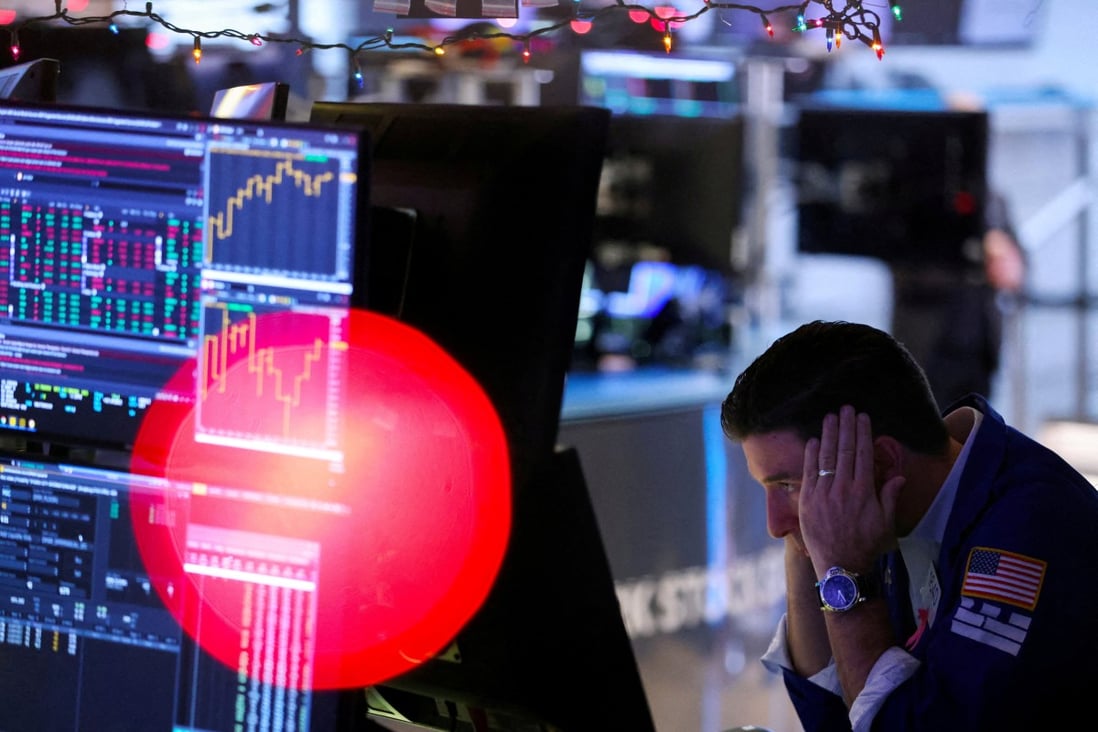 FILE PHOTO: A trader works on the trading floor at the New York Stock Exchange in December 2022. Photo: Reuters