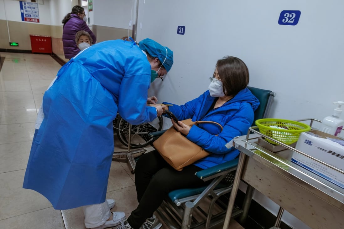 Medical personnel attending to a patient at a hospital in Shanghai on Friday. China says the number of Covid-19 infections across the country is waning. Photo: EPA-EFE