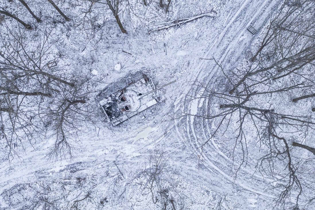 A destroyed Russian tank covered by snow in a forest in the Kharkiv region, Ukraine. Photo: Reuters