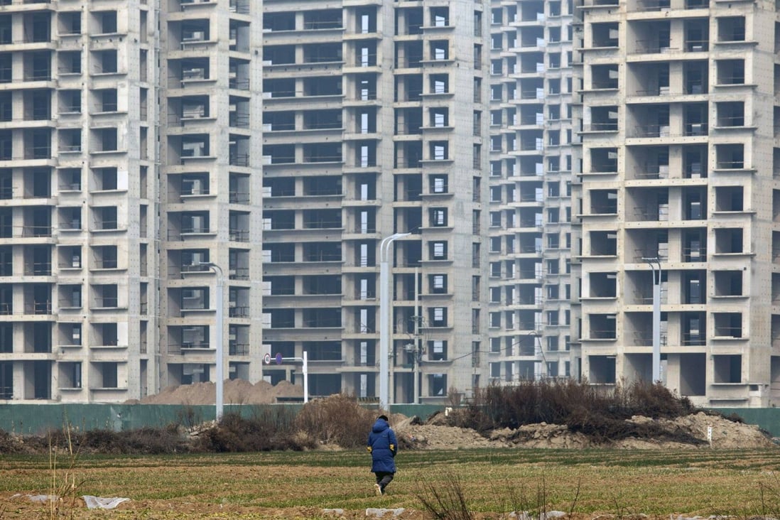 Residential buildings in Zhengzhou, Henan province. China is planning to offer refinancing support to high-quality developers through state-backed bad-debt firms. Photo: Bloomberg
