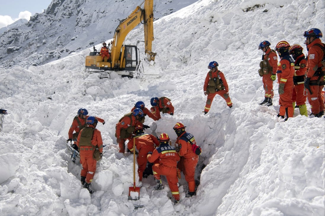 Mechanical diggers take part in the search for survivors following Tuesday’s avalanche in Nyingchi, Tibet. Photo: Xinhua via AP