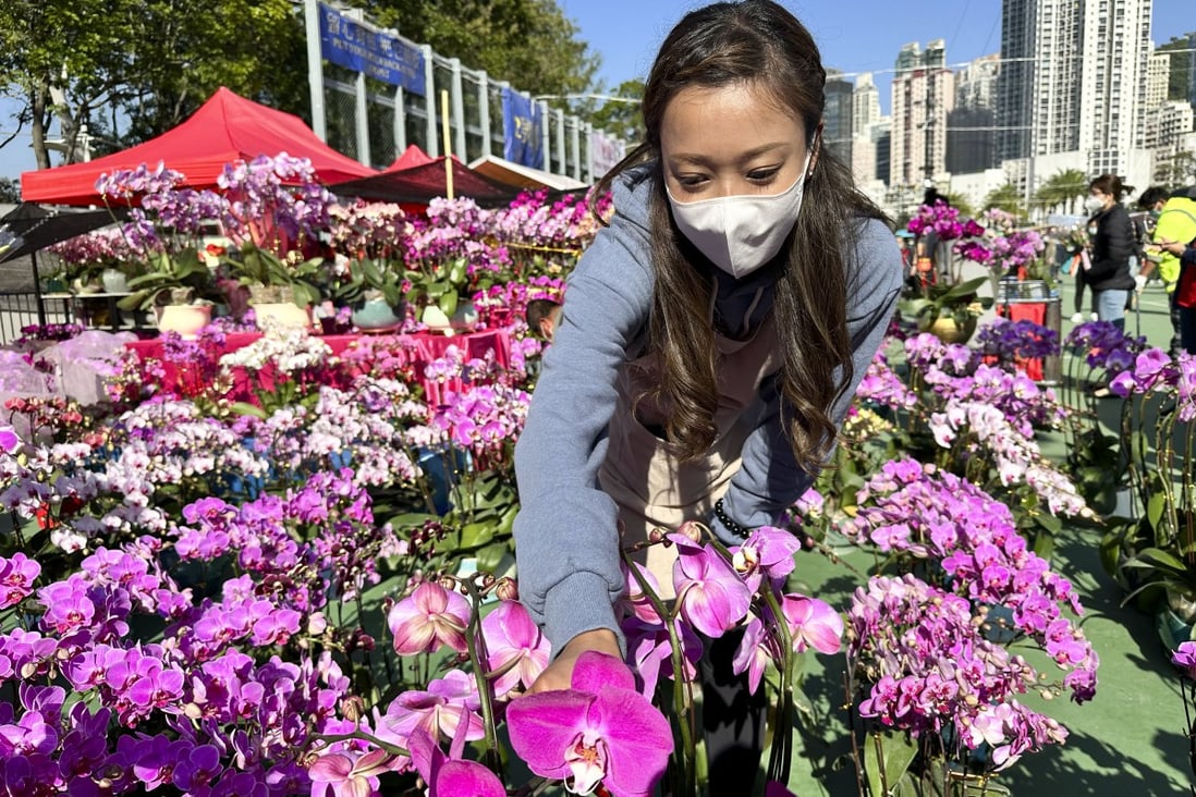 Michelle Ng, selling orchids at the Lunar New Year fair at Victoria Park. Photo: Oscar Liu
