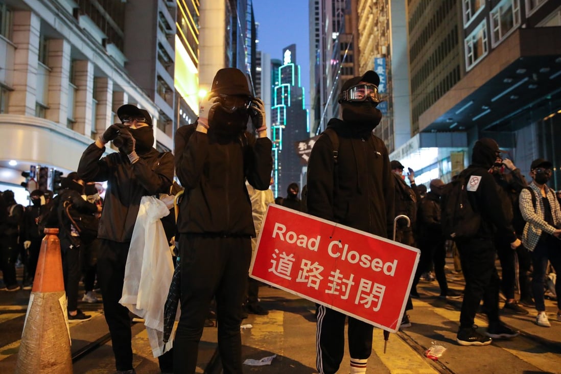 Black-clad protesters in Central in December 2019. Some convicted during the unrest that year have found it challenging to reintegrate into society. Photo: Winson Wong
