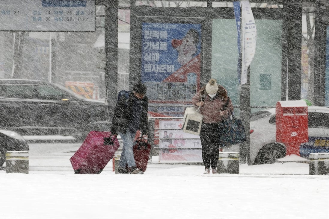Travel is disrupted for many in South Korea and Japan as extreme weather batters the countries. Photo: AP