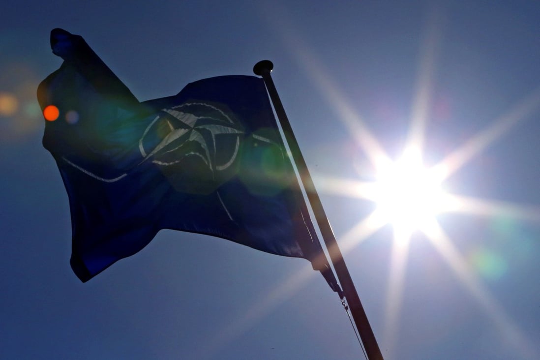A Nato flag flies at the transatlantic security alliance’s headquarters in Belgium. Nato chief Jens Stoltenberg is expected to arrive in Seoul on Sunday then visit Tokyo afterwards. Photo: Reuters