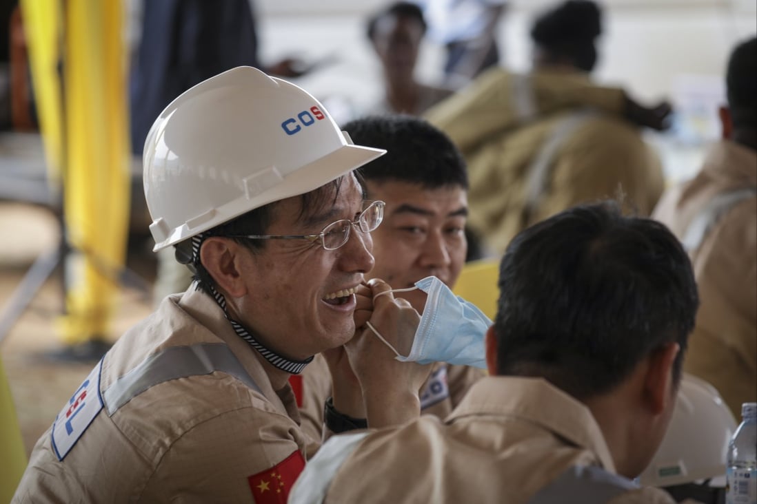Chinese workers at the inauguration of production drilling at Uganda’s Kingfisher oilfield on the shores of Lake Albert. Photo: AP