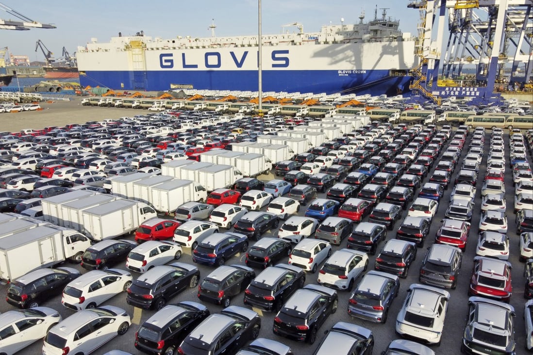 Cars and trucks for export are parked at a port in Yantai in eastern China’s Shandong province. Photo: Chinatopix via AP