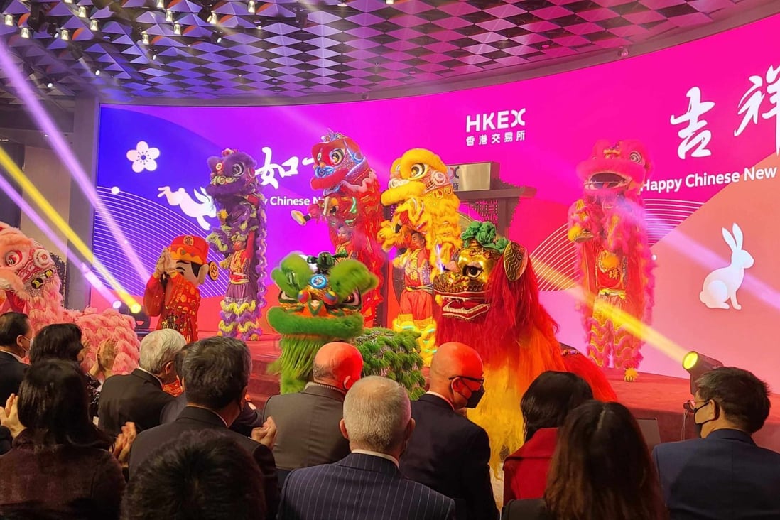 A lion dance highlights the first trading day in the Year of the Rabbit at the Hong Kong stock exchange on January 26. Photo: Enoch Yiu