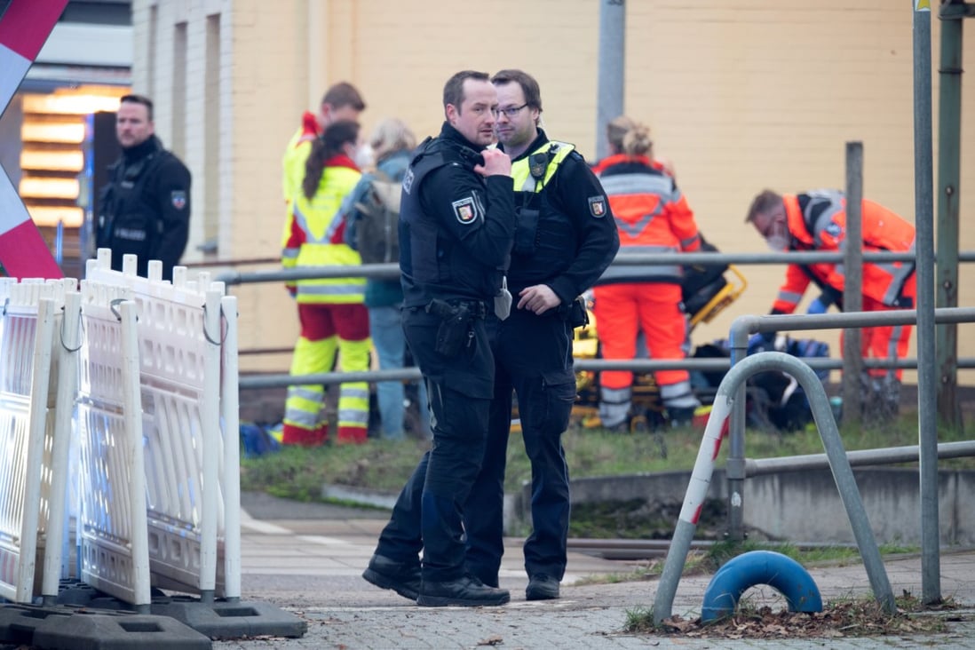 Police and emergency services personnel are seen on duty at a level crossing at Brokstedt station in Germany on Wednesday. Photo: dpa