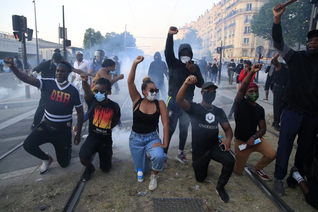Protesters gesture during a demonstration against police violence and racial injustice in Paris in June 2020. Photo: AP