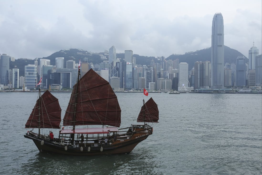A traditional Hong Kong junk cruises scenic Victoria Harbour, some of the unique aspects of a trip to the city to be highlighted in a new promotional campaign. Photo: SCMP