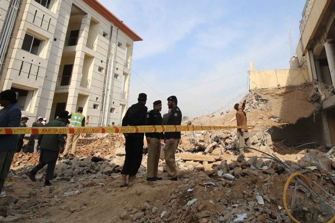 Police inspect the damage at a Mosque that was destroyed in a suicide bomb blast on January 30, in Peshawar, Pakistan. Photo: EPA-EFE