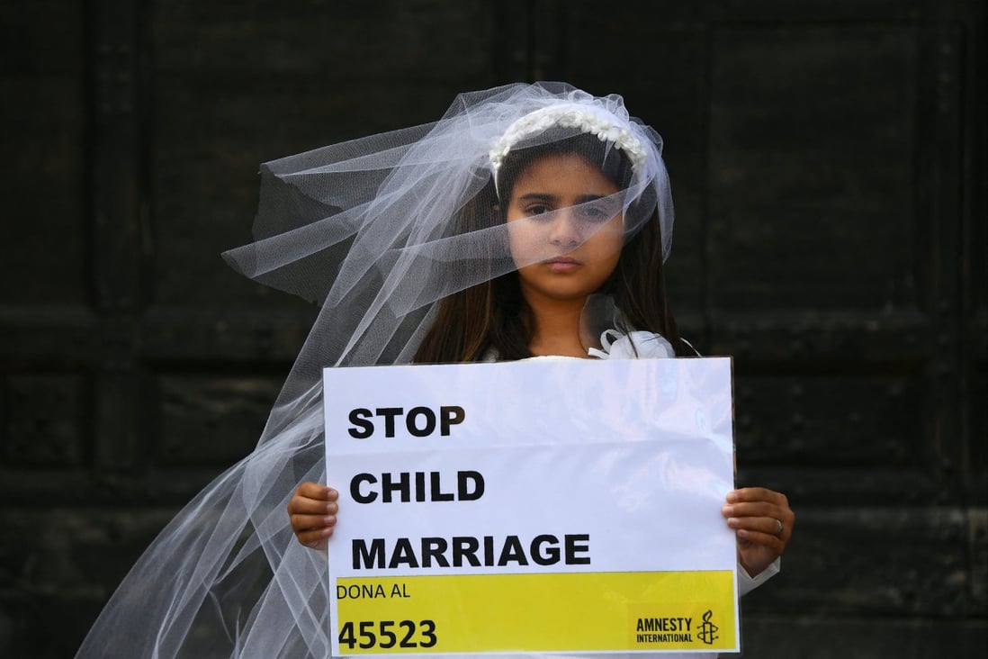 A young actress plays the role of an underage bride as part of an event organised by Amnesty International. Photo: AFP