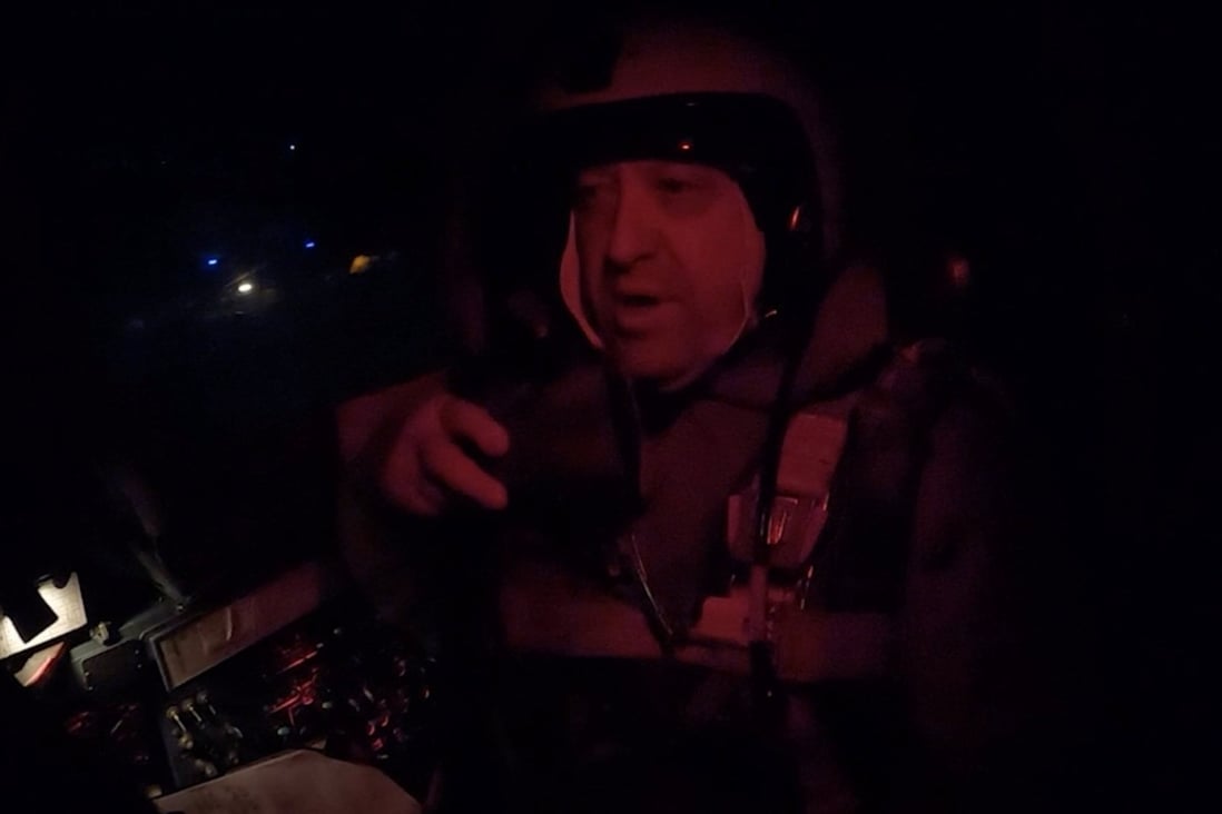 Yevgeny Prigozhin, the founder of Russia’s Wagner mercenary group, is seen inside a cockpit of a military Su-24 bomber plane over an unidentified location in footage released on Monday. 