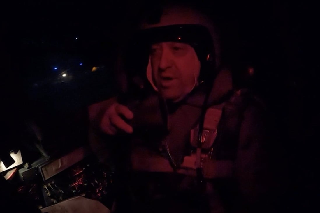 Yevgeny Prigozhin, the founder of Russia’s Wagner mercenary group, is seen inside a cockpit of a military Su-24 bomber plane over an unidentified location in footage released on Monday.