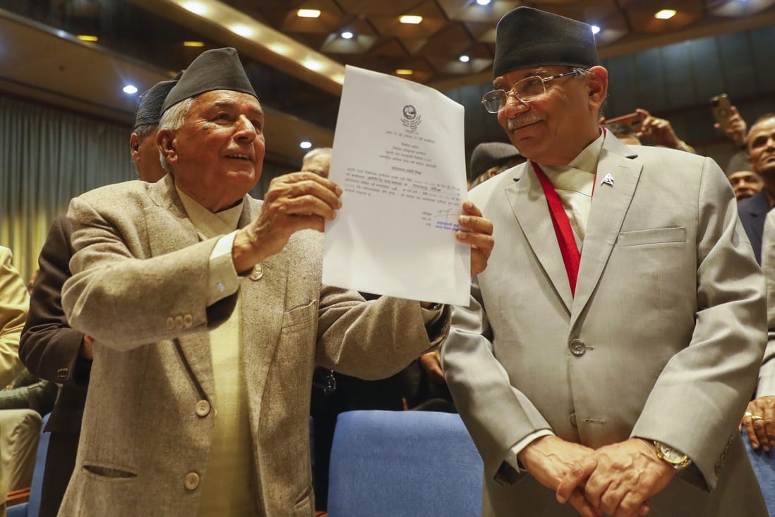 Nepalese Prime Minister Pushpa Kamal Dahal (right) looks on as Ram Chandra Poudel of the Nepali Congress party shows his candidacy papers after filling his nomination to become Nepal’s next president as in Kathmandu, Nepal, Saturday, February 25, 2023. Photo: AP