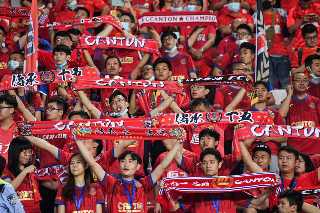 Fans cheer for their team during the Chinese Super League football match between Guangzhou FC and Guangzhou City in 2021. Photo: AFP