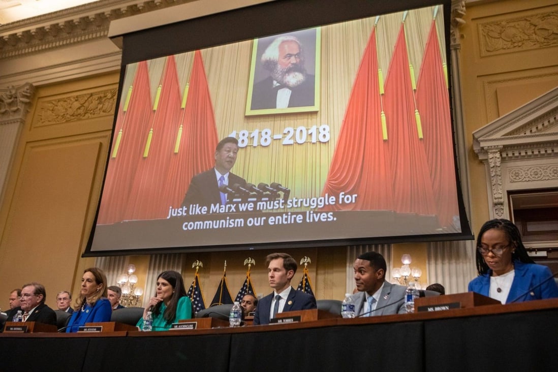 US House committee members watch a video about China’s Communist Party during a hearing in Washington on Tuesday. Photo: Bloomberg