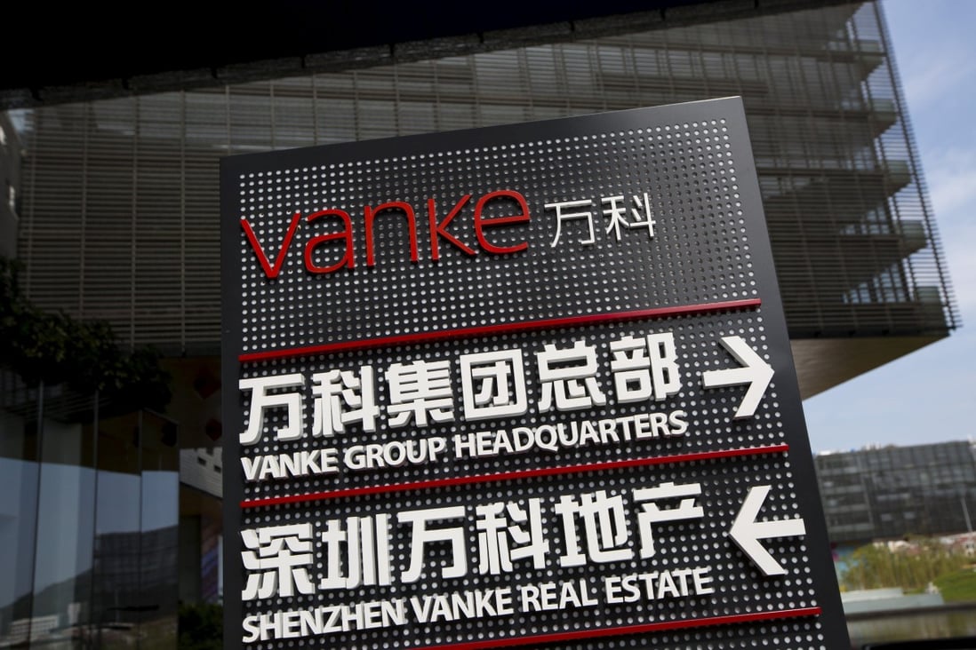 Signs show the direction of Vanke group headquarters in Shenzhen. Photo: Reuters