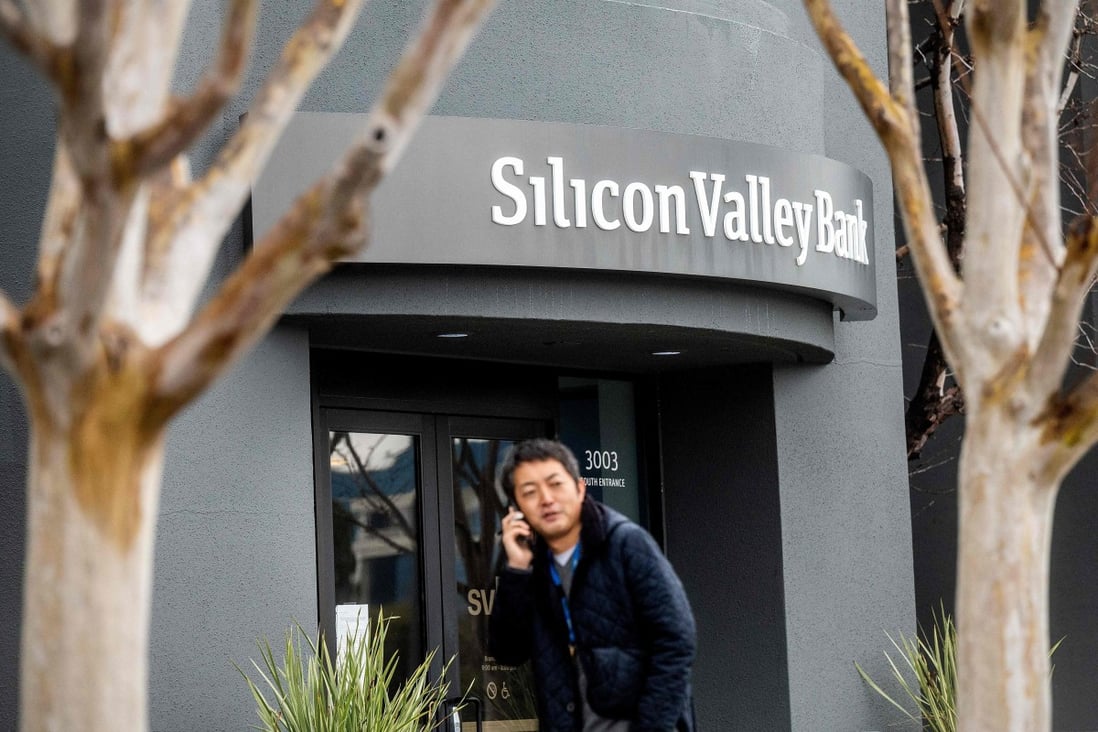 A pedestrian speaks on a smartphone as he walks past Silicon Valley Bank’s headquarters in Santa Clara, California, on March 10, 2023. Photo: Agence France-Presse