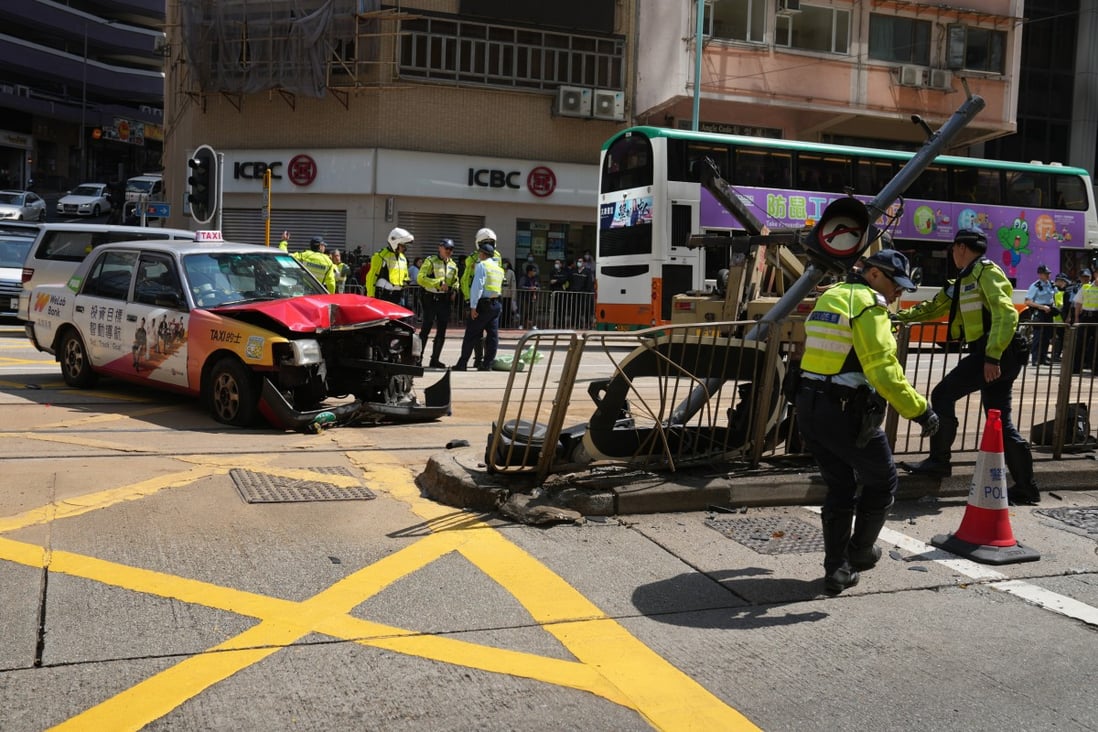 Police investigate a traffic accident on King’s Road in Fortress Hill on March 5. At least three people were injured after a taxi ploughed into pedestrians at a crossing. Photo: Sam Tsang